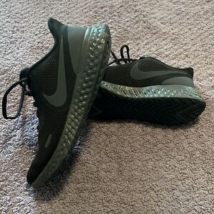 All black Nikes Tennis shoes